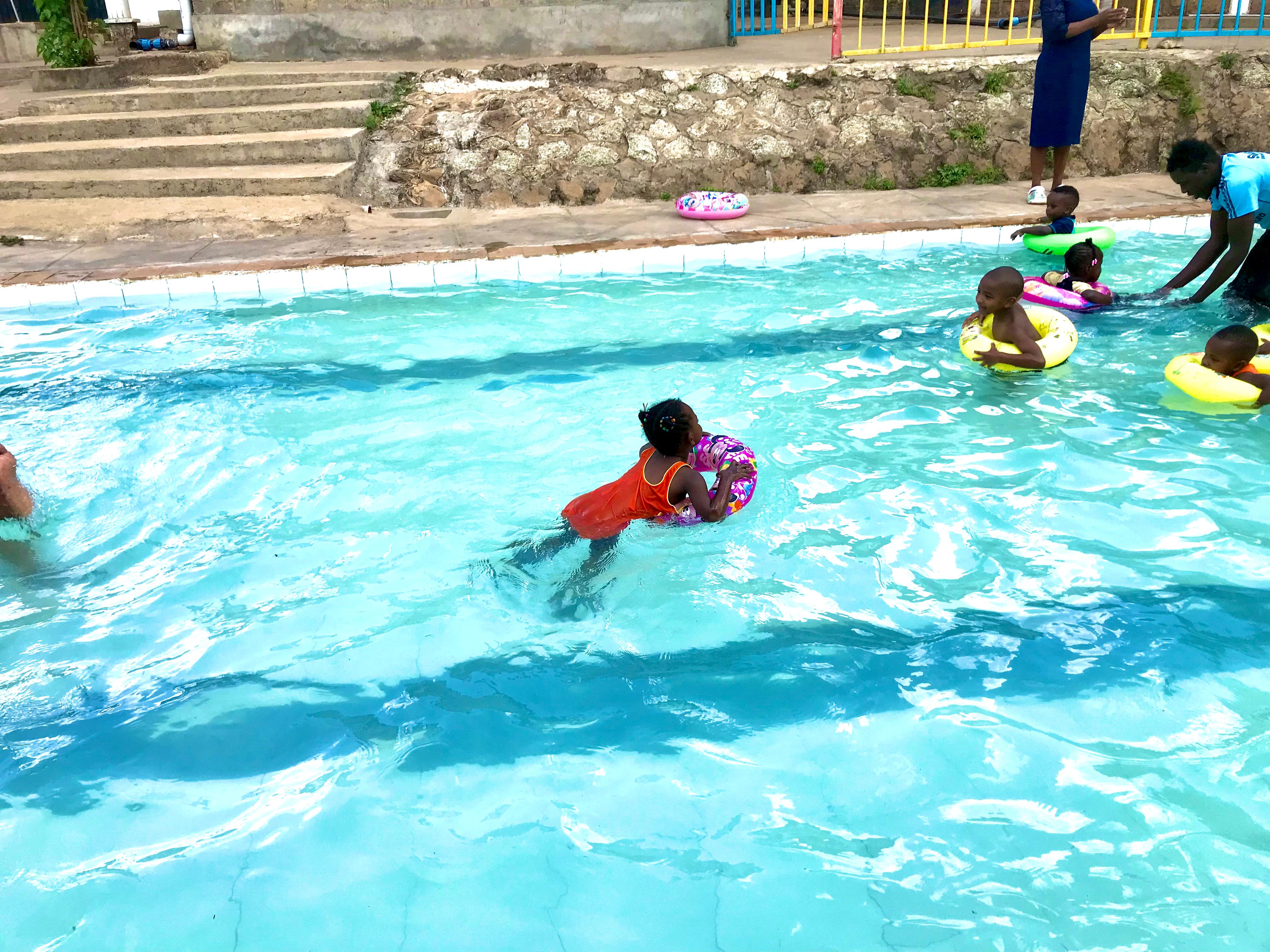 Kids swimming outside